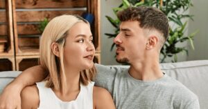 Ac couple looking at each other as they thinking about different pregnancy options
